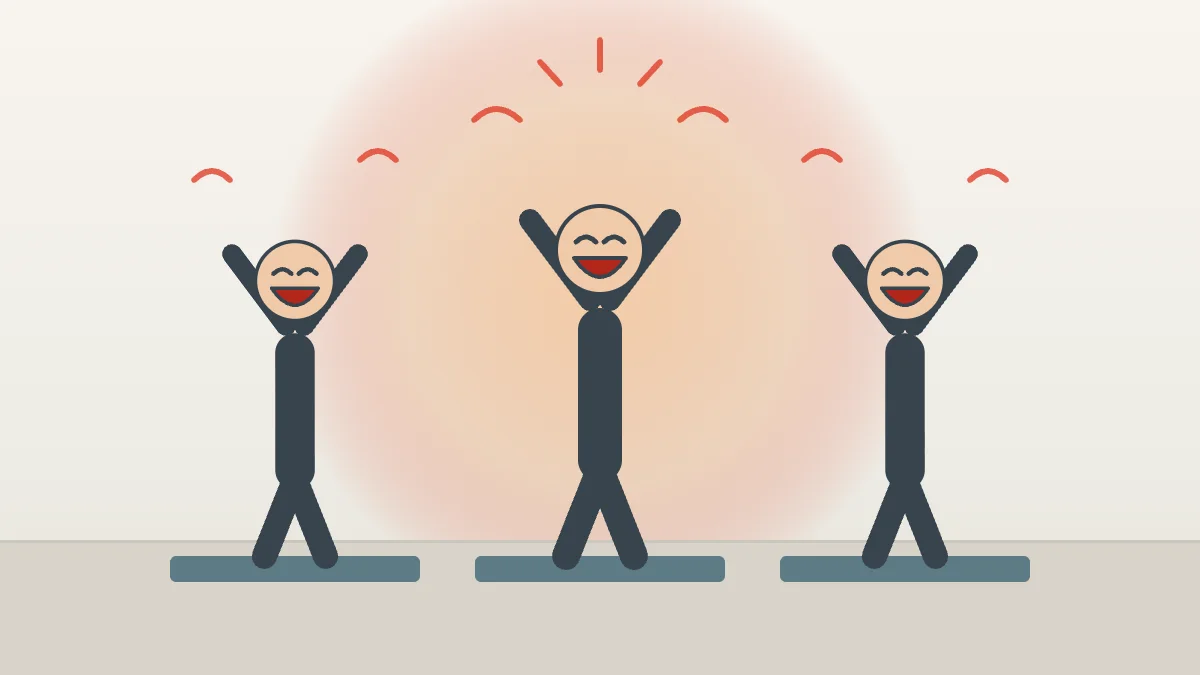 Trois personnes rient les bras levés sur des tapis de sport lors d'une séance de yoga du rire